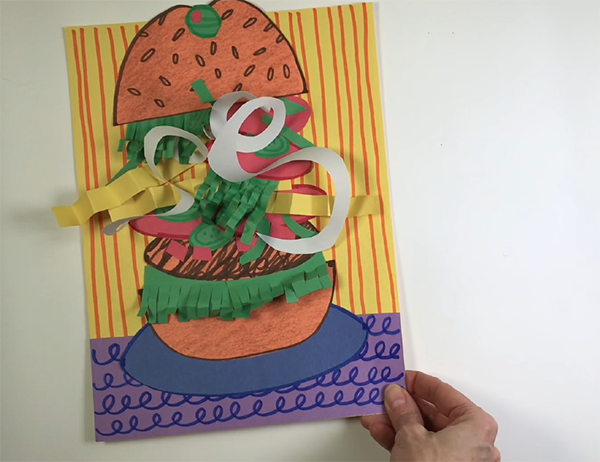 Colorful paper collage of a whimsical hamburger with vibrant toppings.